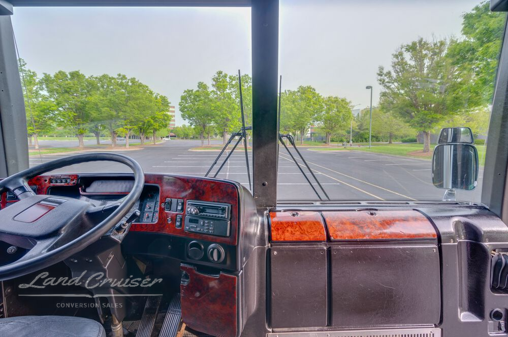 Forward windshield view from Prevost entertainer bus showcasing road visibility and cockpit layout