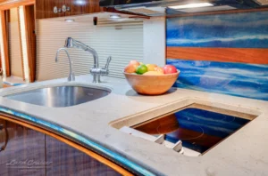 Solid-surface countertop and induction cooktop in Prevost motorhome kitchen