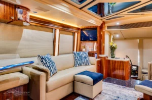Cream leather sofa lounge inside Marathon Prevost conversion coach