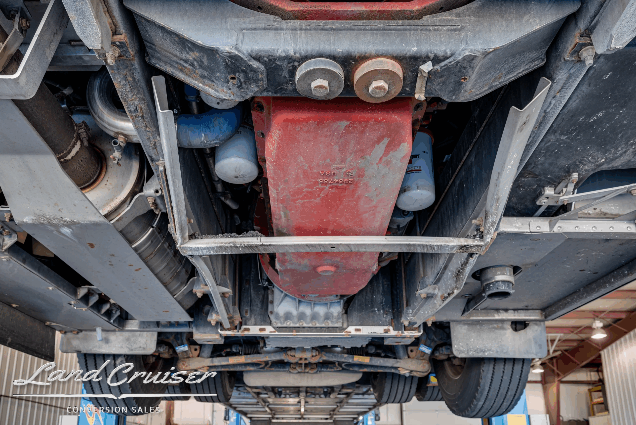 Undercarriage crossmember and steering linkage (front).